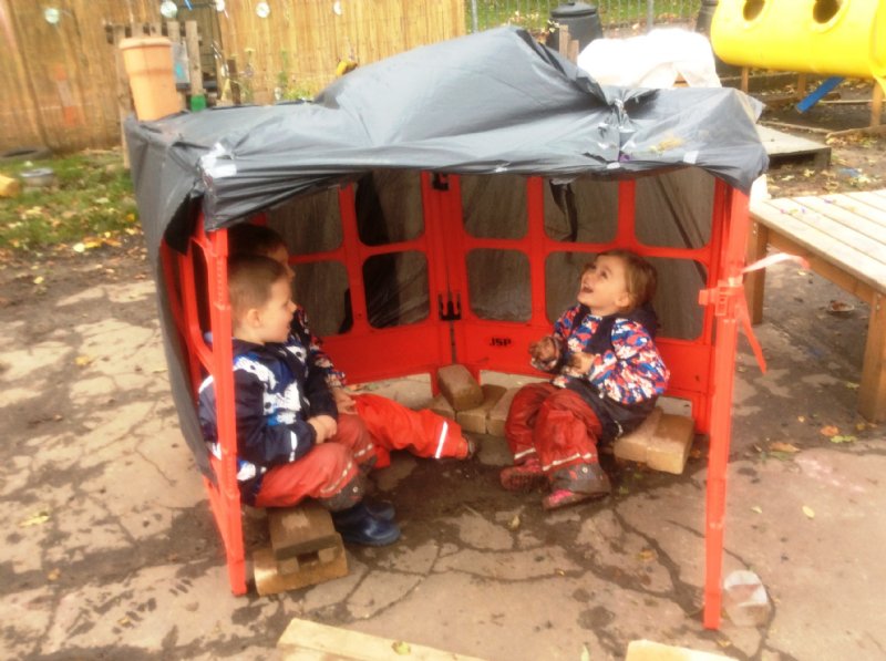 children chilling in shanty tent